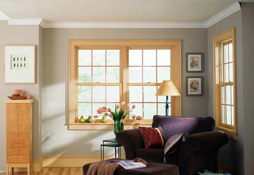 Neutral living room with Andersen 200 series double-hung windows.