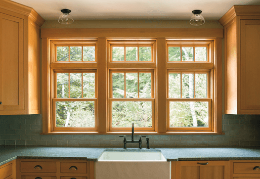 Interior view of kitchen with Andersen wood windows with fractional grilles